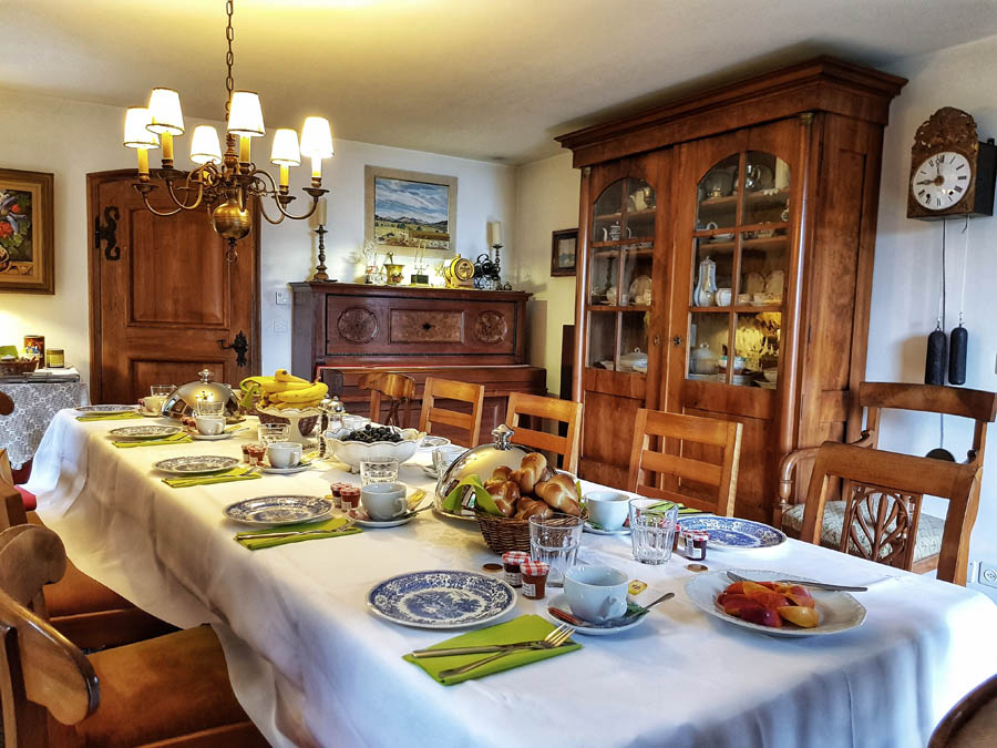 Elegant table with white linen in a warm interior setting