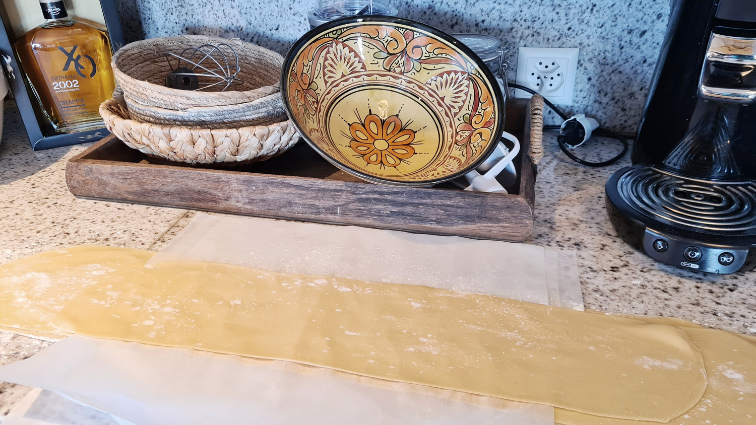 Long sheet of freshly rolled pasta dough.