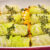 French stuffed cabbage rolls with thyme arranged over vegetables before braising