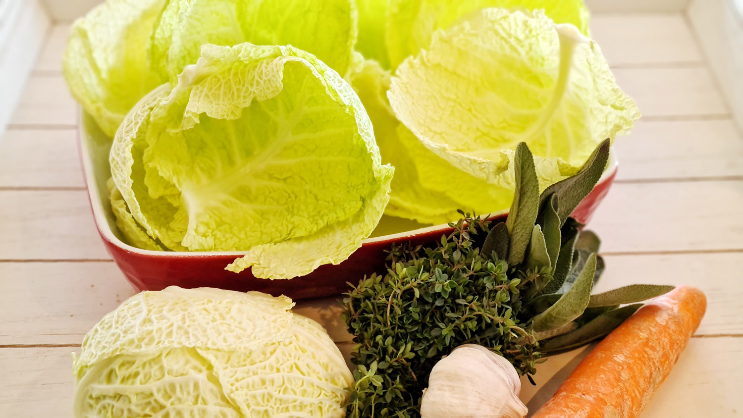Savoy cabbage and fresh vegetables prepared for French cabbage rolls