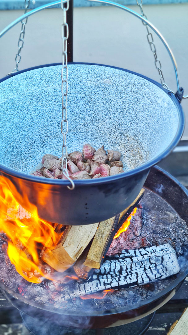 Hungarian goulash ingredients prepared for cooking over an open fire
