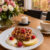 Rustic Apple & Raspberry Oat Bake served with yogurt, fresh fruit and coffee