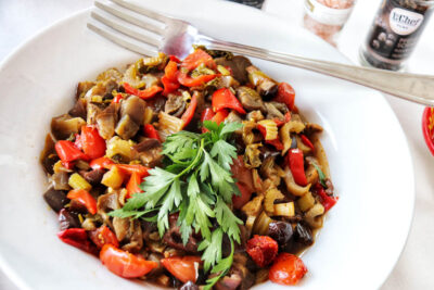 Mediterranean aubergine and red pepper dish by Angela Carnelutti in Zurich
