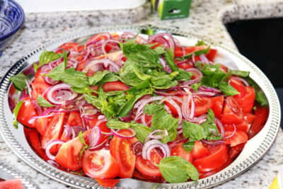 Angela Carnelutti – Italian Catering Zurich Fresh tomato salad with red onions and basil by Angela Carnelutti in Zurich