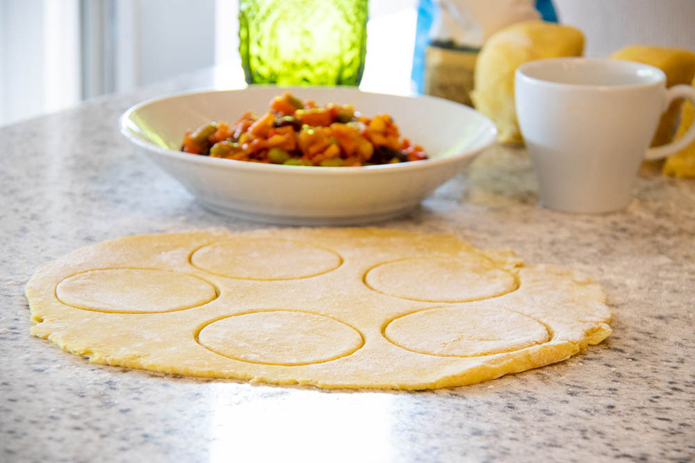 Cutting pastry rounds for Curry Masala Empanadas