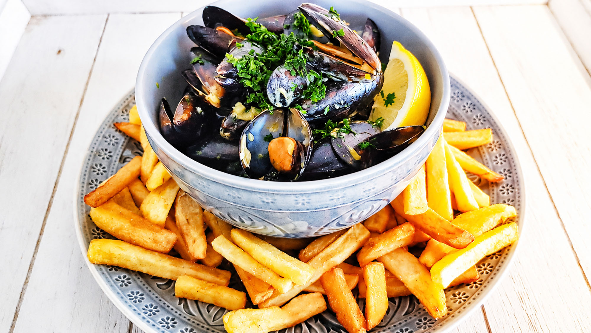 Moules et Frites served with golden French fries by Alessandro Cipriano